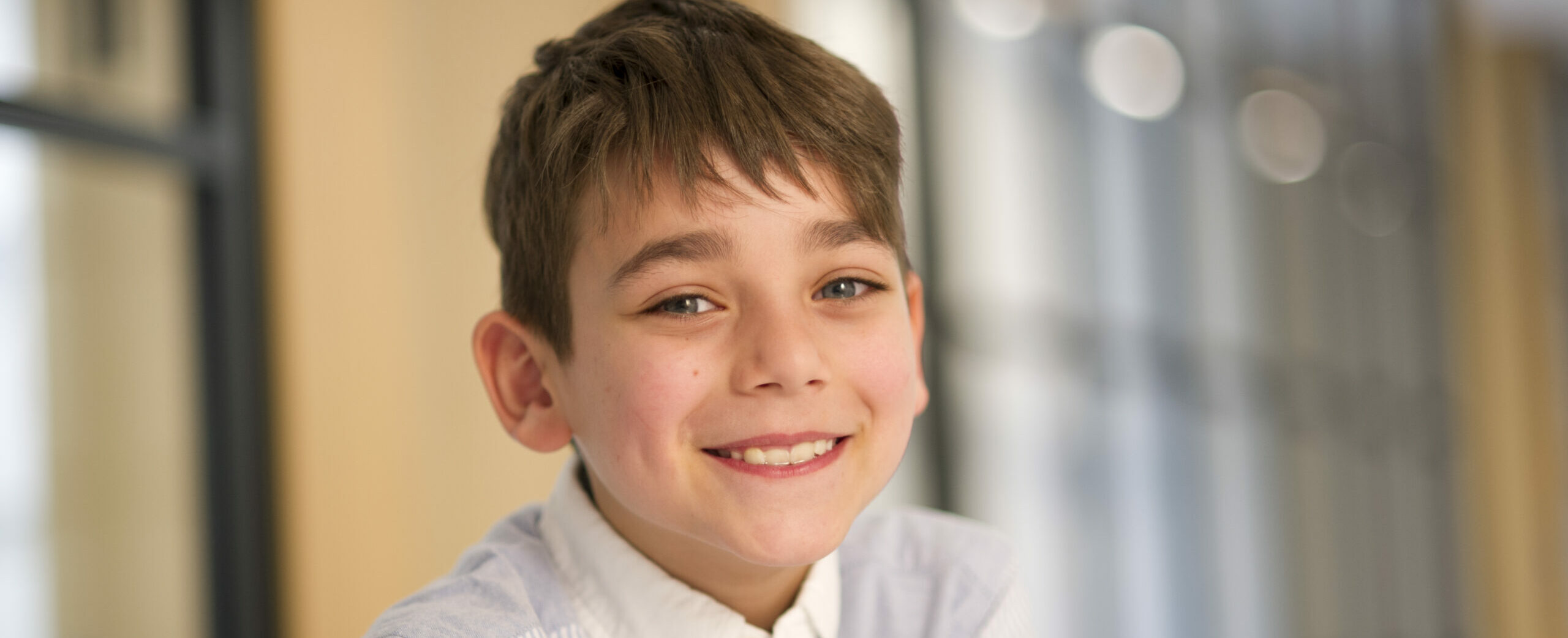 Smiling little boy with temporomandibular joint disease